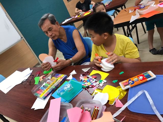 Grandpa and Chong take part in art and craft activities as a way to strengthen their bonds.