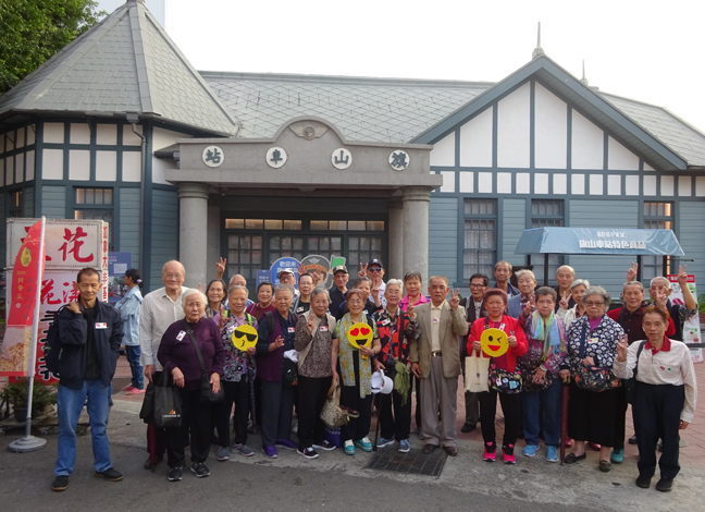 The elders take a group photo as they travel out of Hong Kong for the first time.